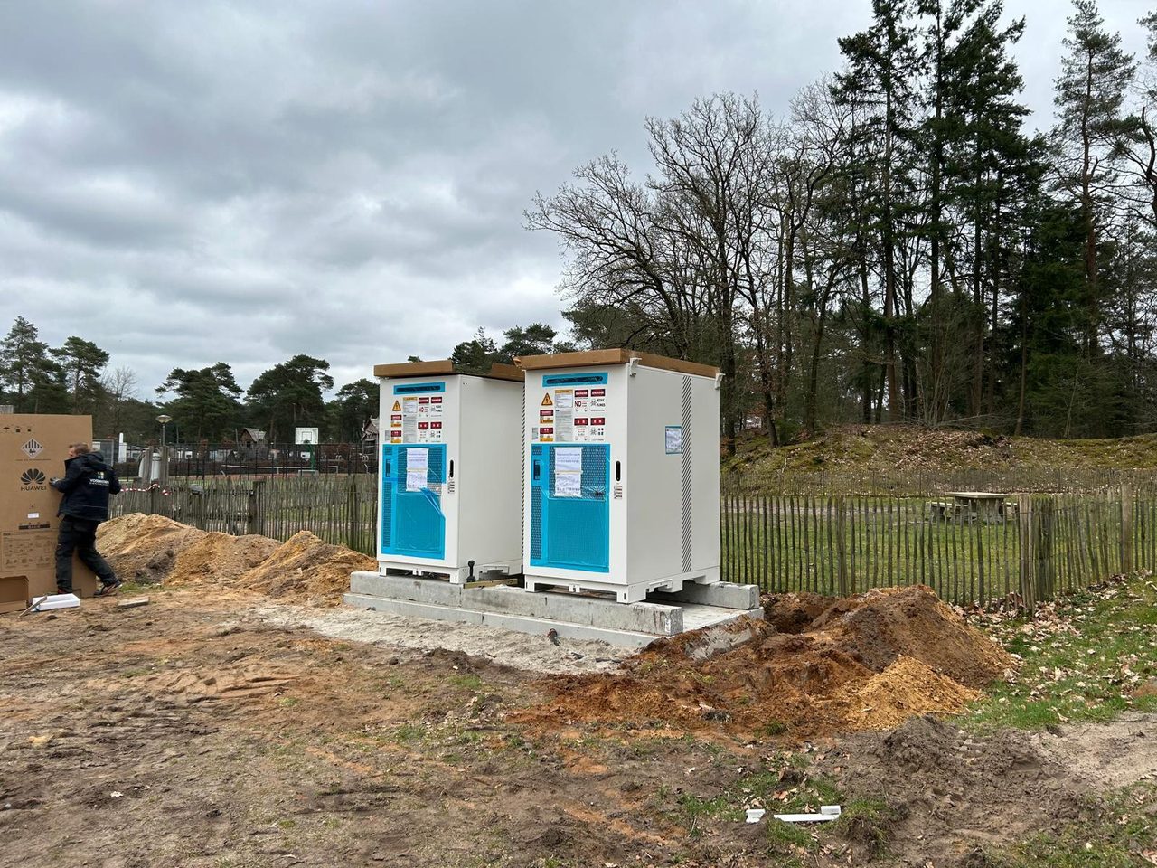 Battery storage cabinets being installed on a prepared site