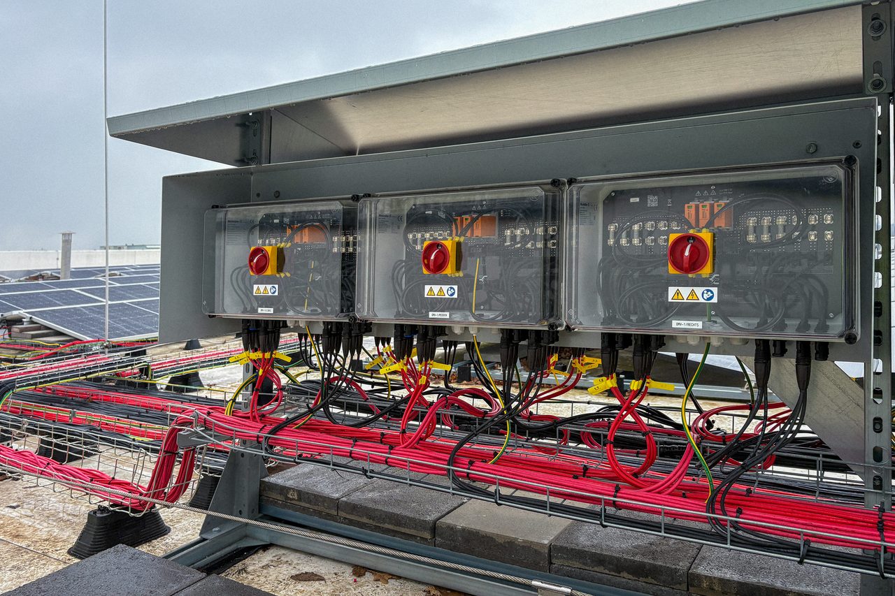 Rooftop combiner boxes wired for a solar and storage system