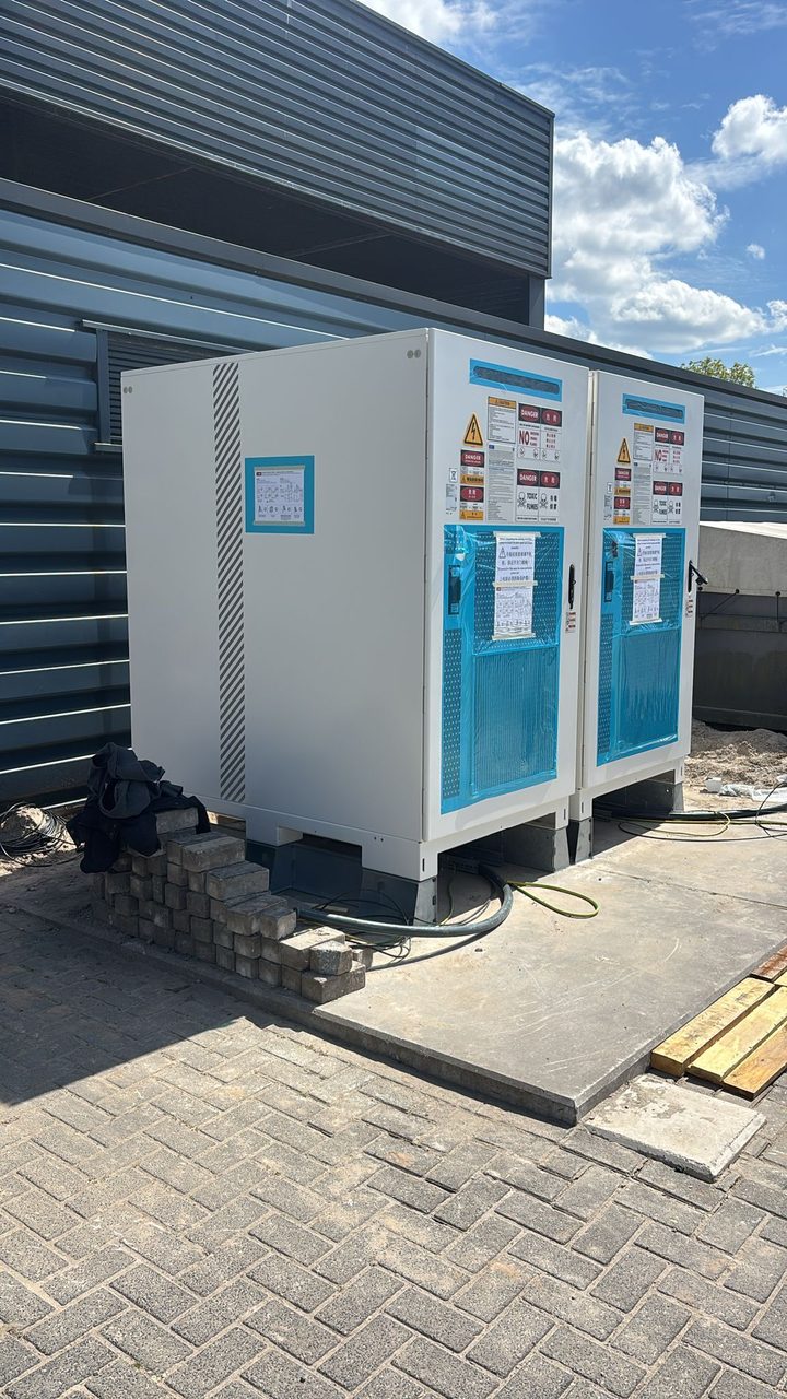 Battery storage cabinets installed beside a building