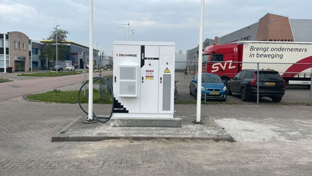 Outdoor battery storage cabinet at a commercial site entrance