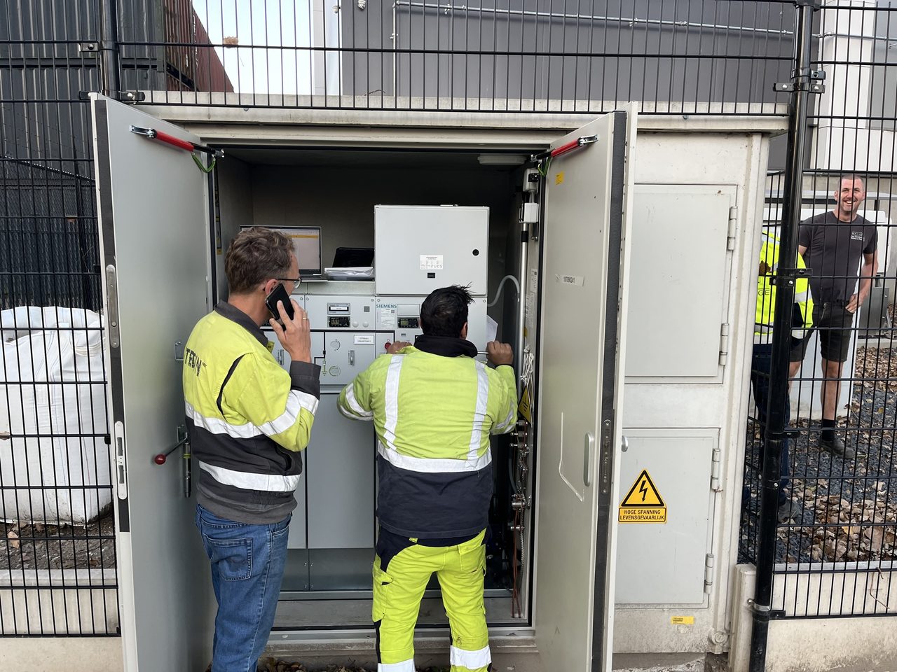 Engineers commissioning a battery storage system